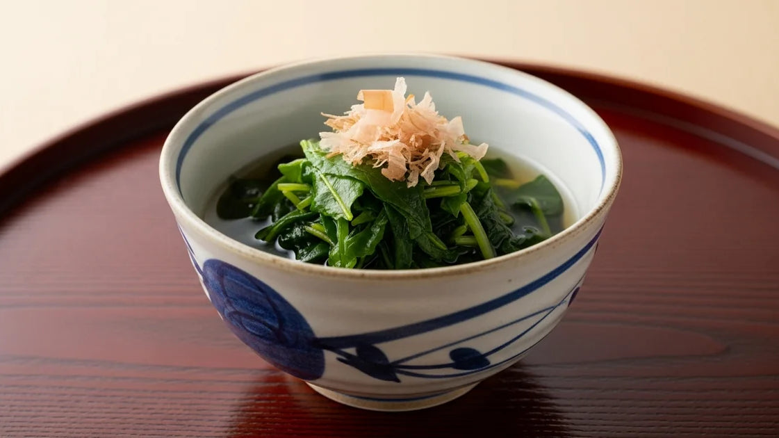 Japanese ohitashi dish made with green tea leaves in a ceramic bowl with dashi